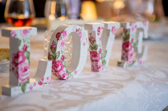 white and pink floral freestanding letter decor